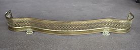 Antique brass paw foot fireplace fender, structurally sound, does show patina. 6.5"h x 49"w x 9.5"dImage - 2