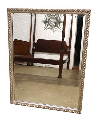 Carved silver framed and beveled glass mirror, can be hung either way. 49"h x 37.5"w