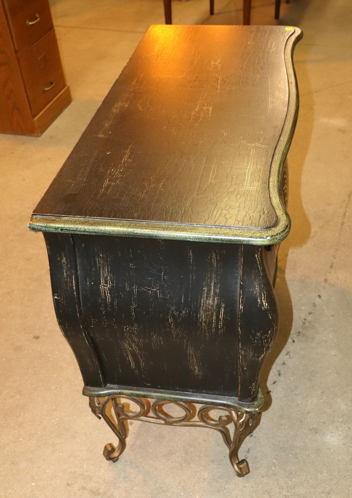 Parrot paint decorated chest on scroll metal legs