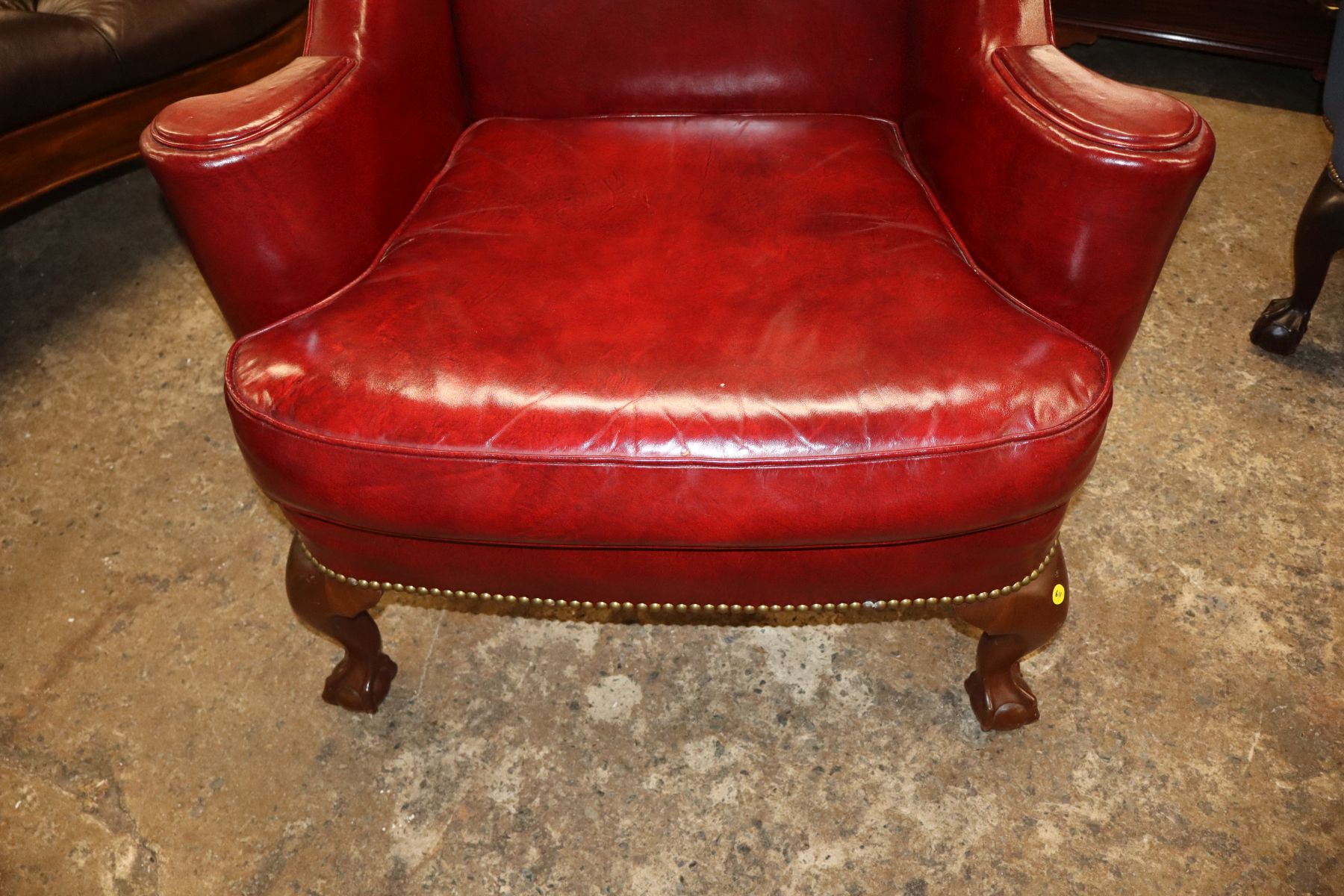 Quality burgundy leather ball & claw wing chair