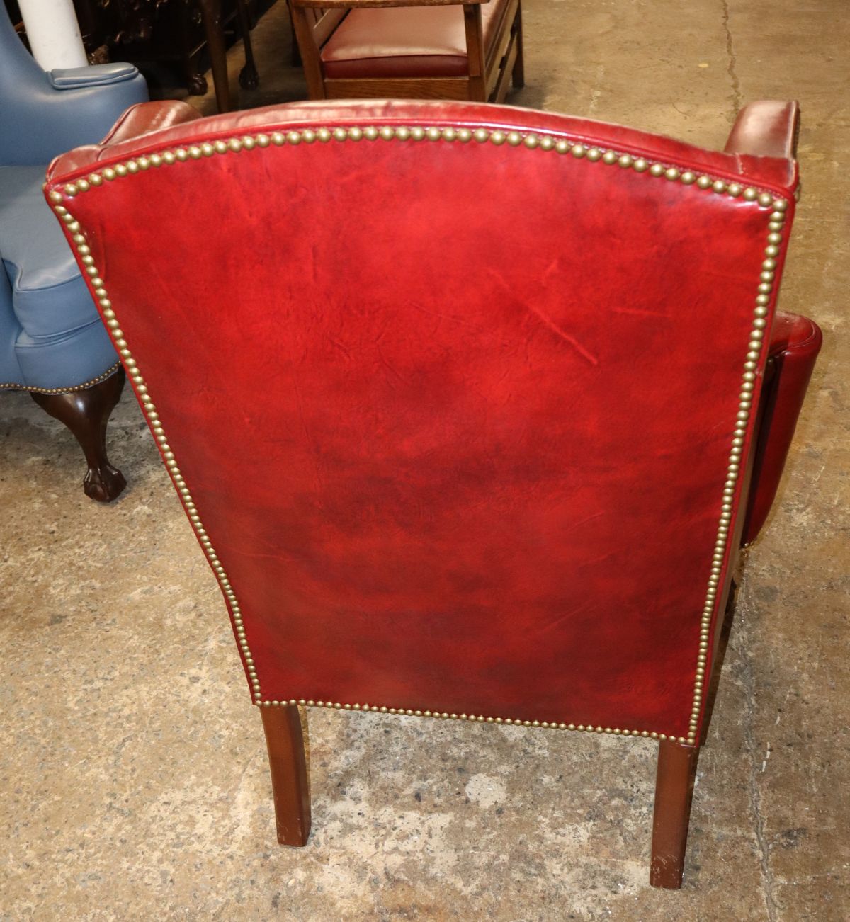 Quality burgundy leather ball & claw wing chair