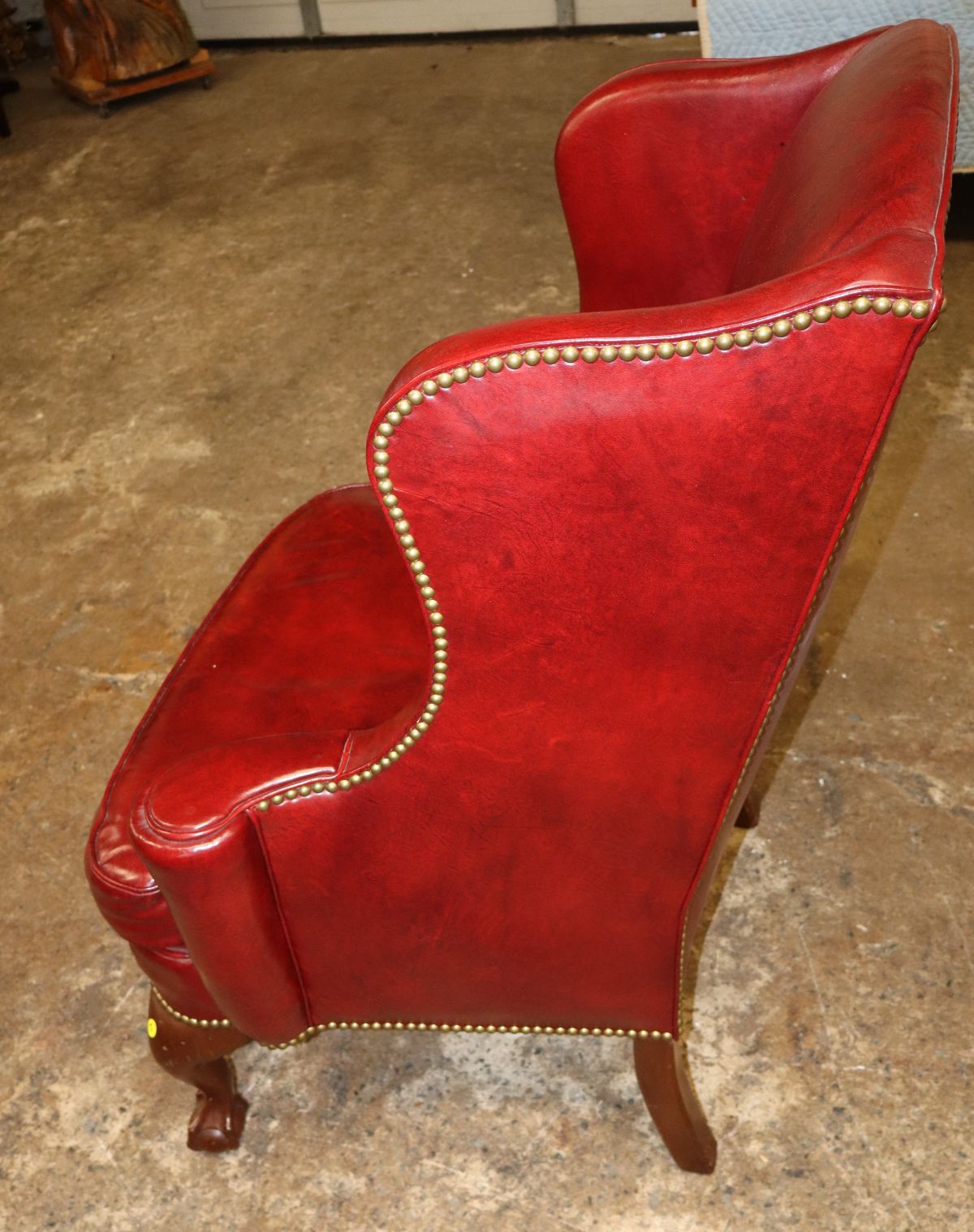 Quality burgundy leather ball & claw wing chair