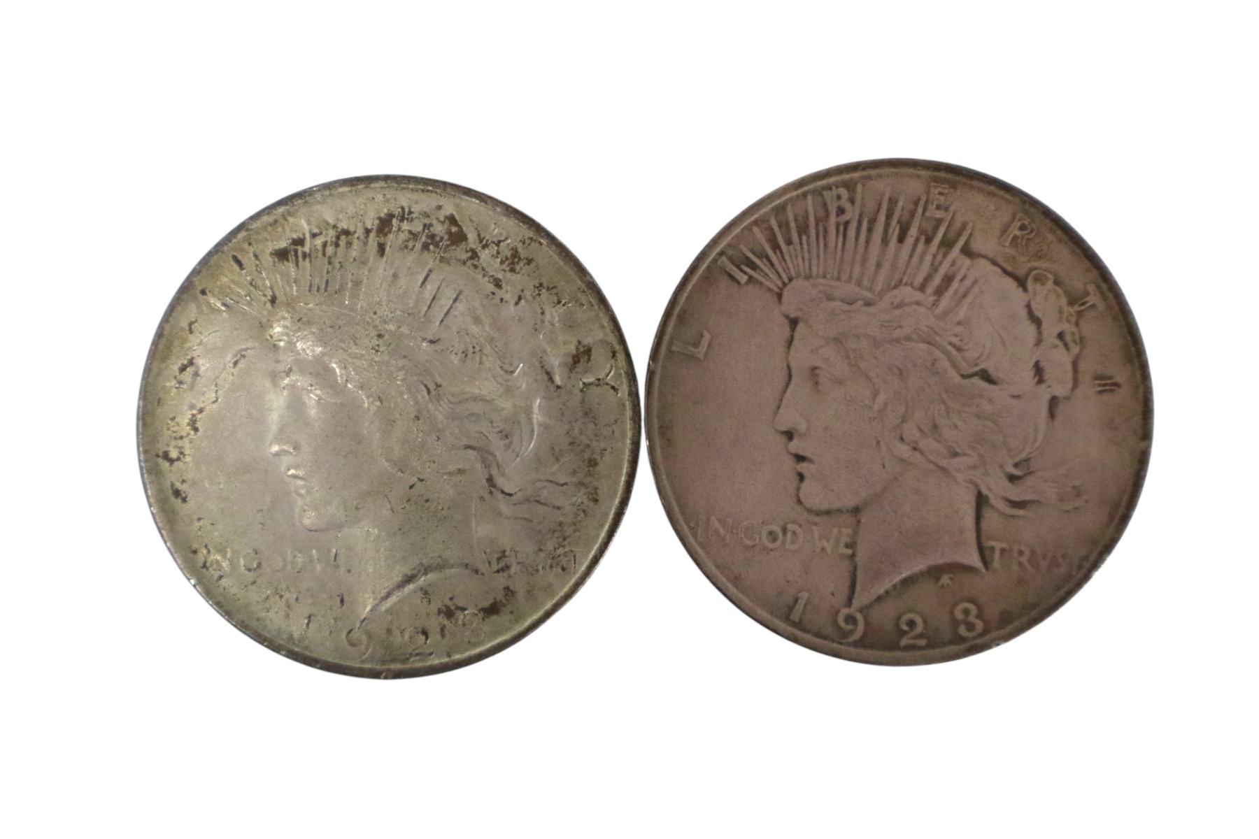 (2) US silver peace dollar $1 coins dated 1923 & 1923