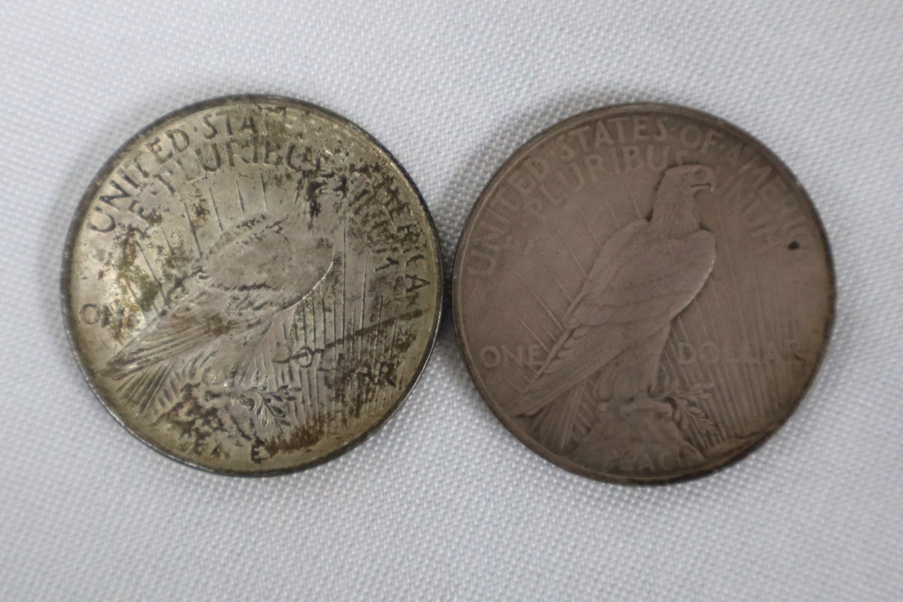 (2) US silver peace dollar $1 coins dated 1923 & 1923
