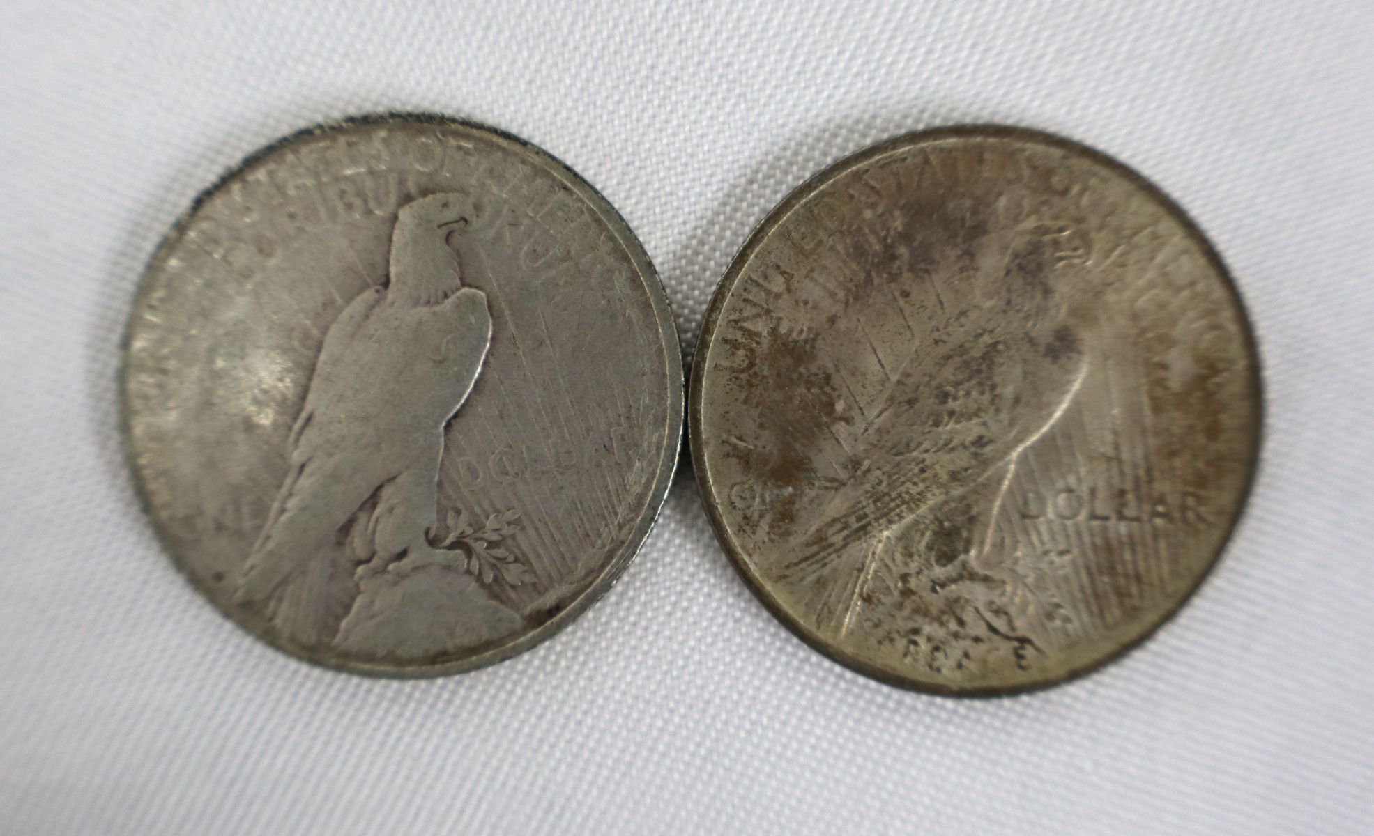 (2) US silver peace dollars $1 dated 1923 & 1923