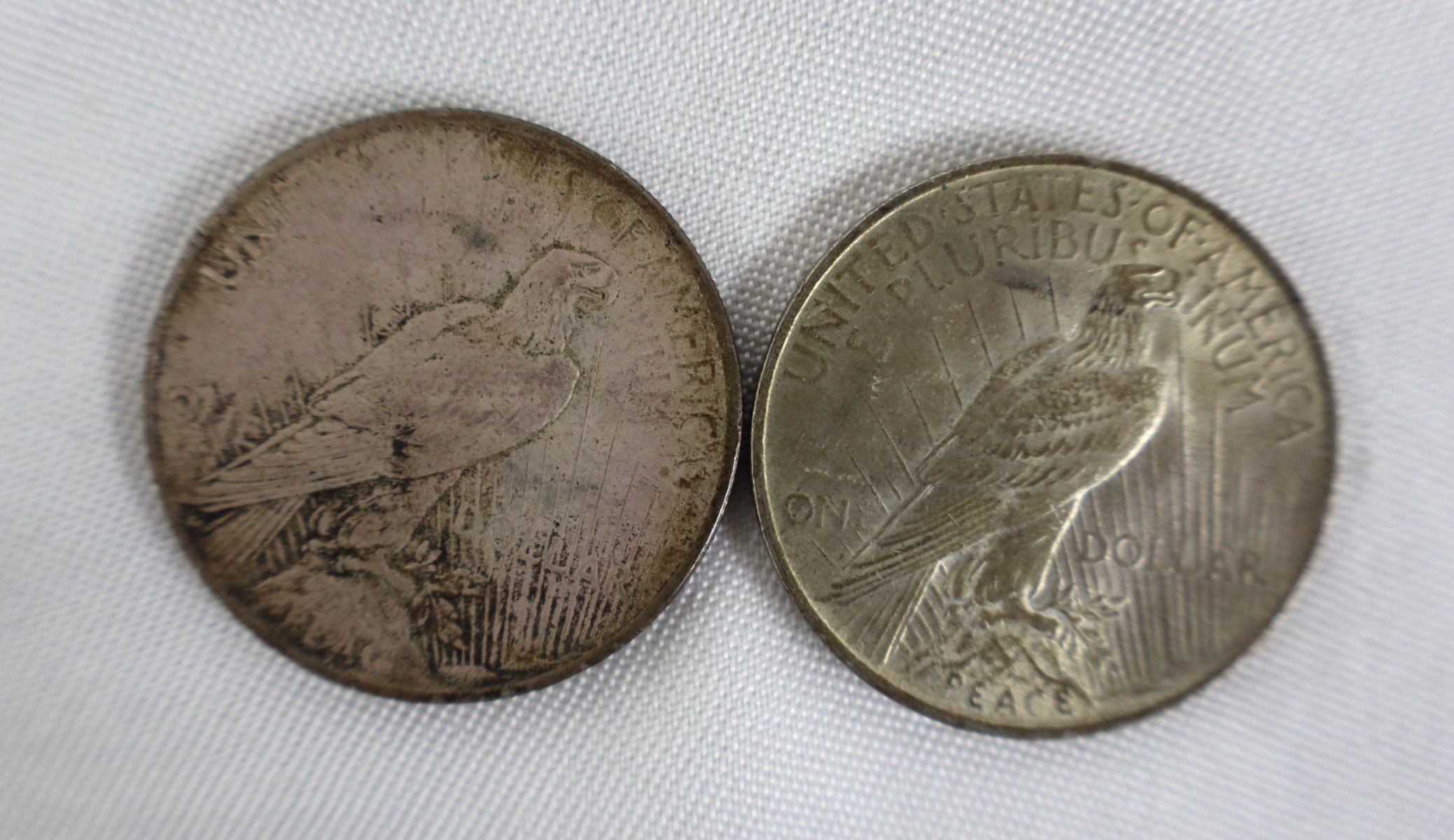 (2) US silver peace dollars $1 dated 1923 & 1923