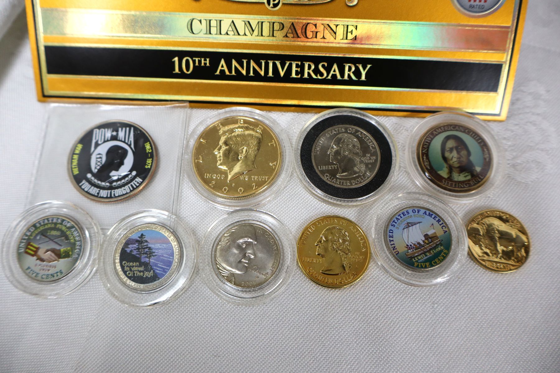11pc lot: 10 painted halfs, nickels, quarters and Champagne Cigar Box