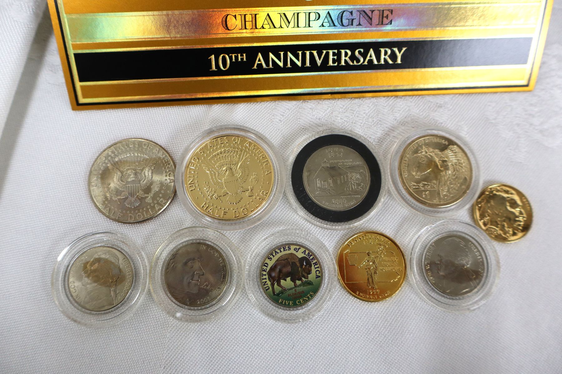 11pc lot: 10 painted halfs, nickels, quarters and Champagne Cigar Box