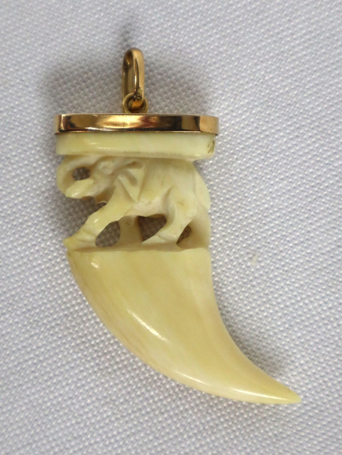 18k yellow gold pendant with carved elephant tooth