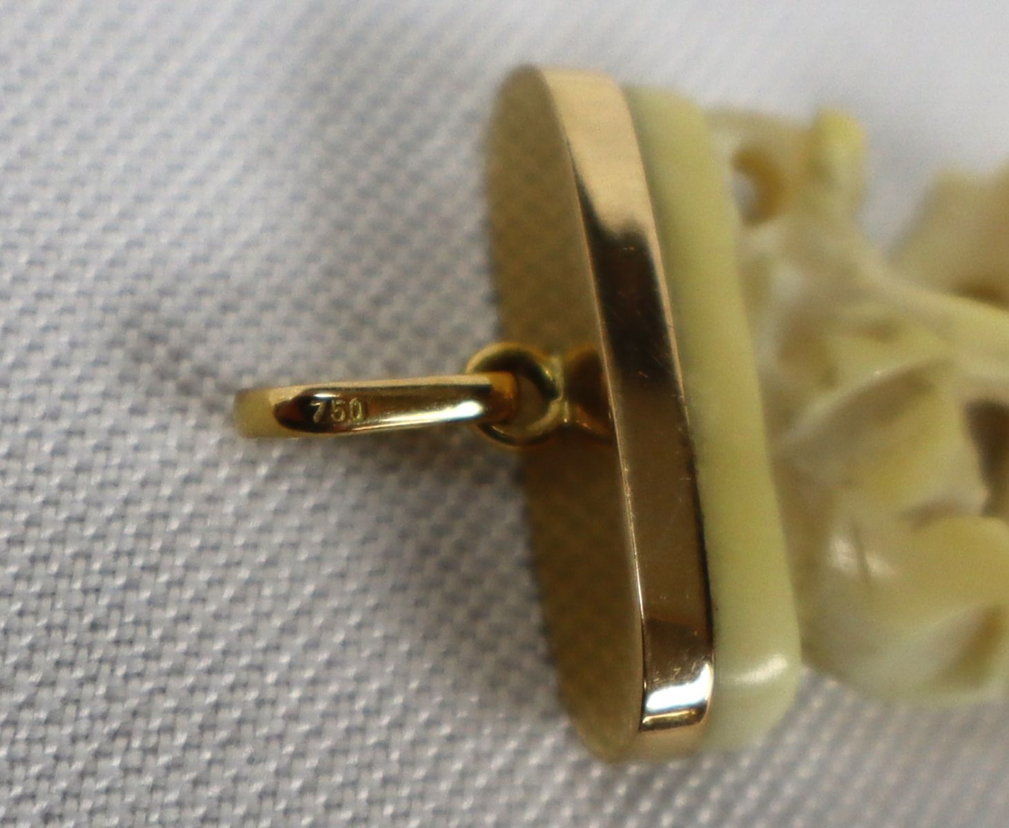 18k yellow gold pendant with carved elephant tooth