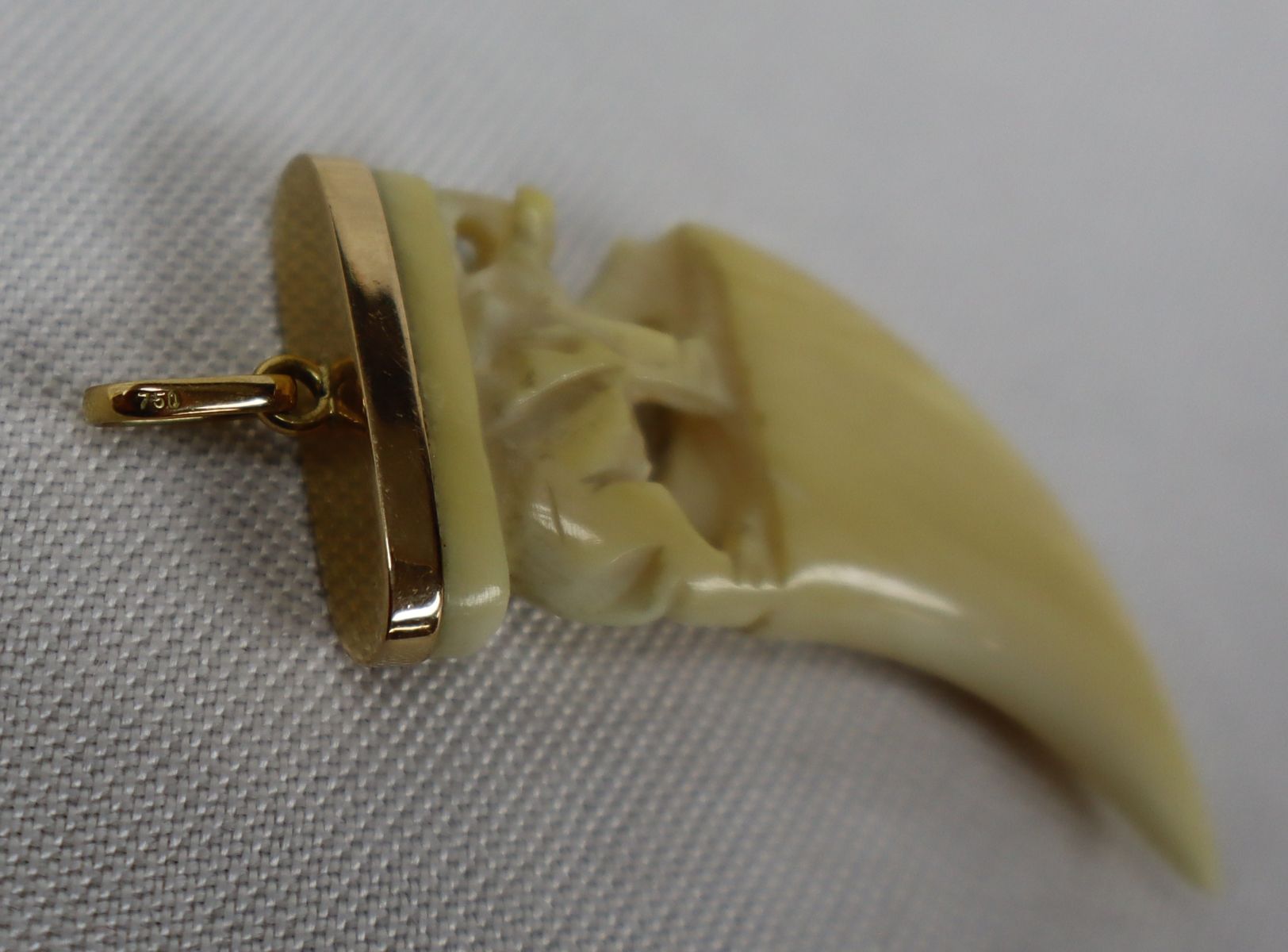 18k yellow gold pendant with carved elephant tooth