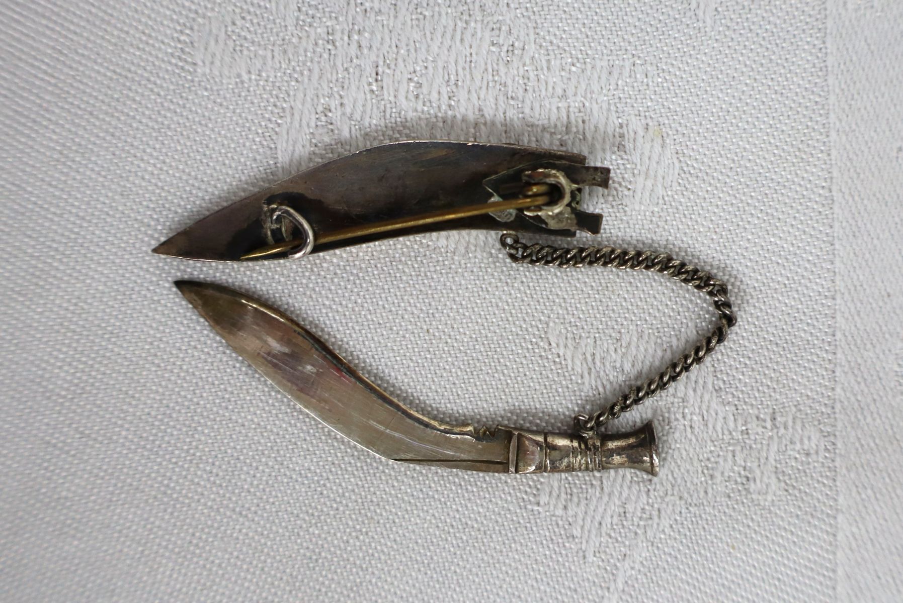 Asian silver knife brooch with sleeve