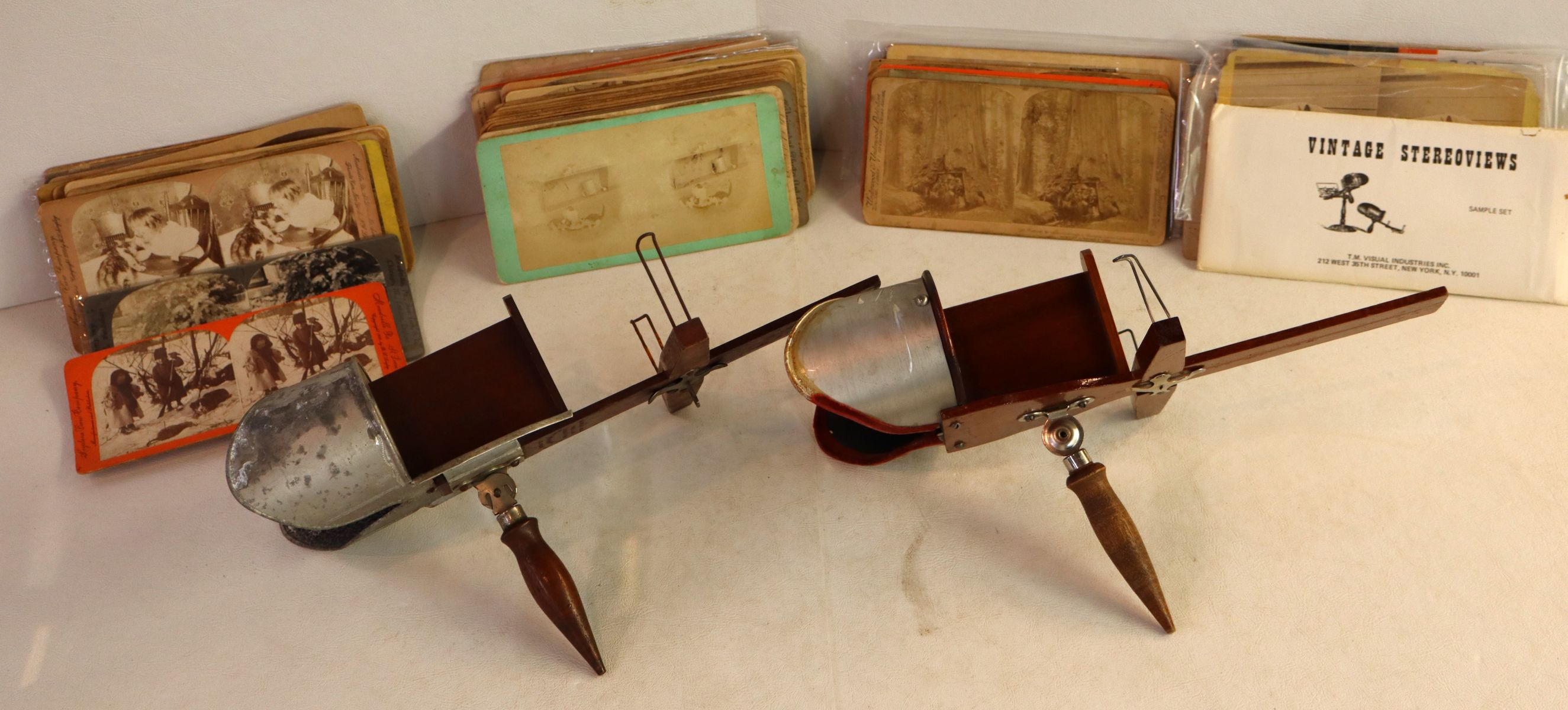 2 vintage stereo viewers with cards