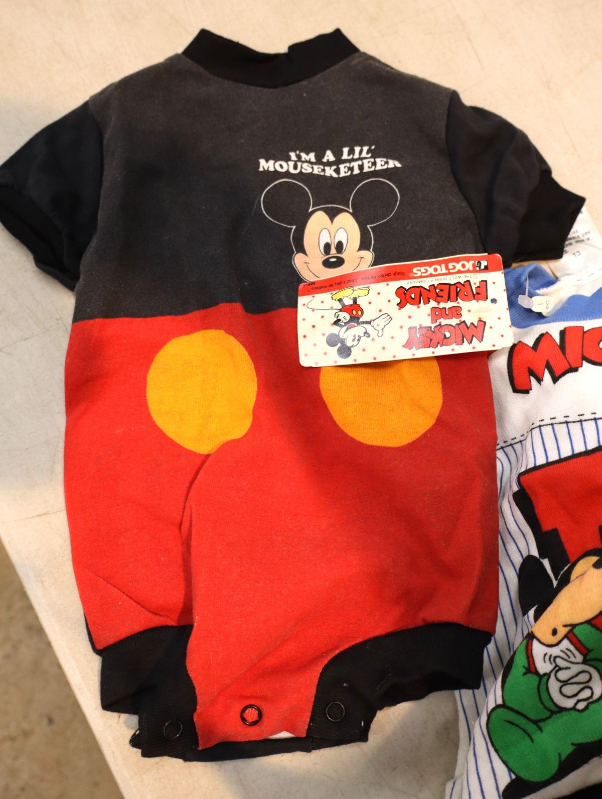 Vintage selection of Mickey Mouse books, toys and other
