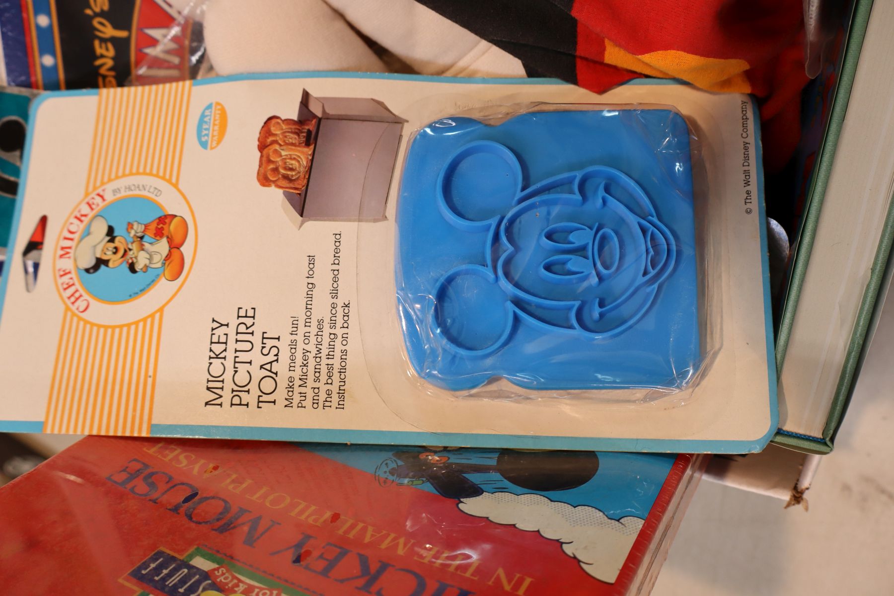 Vintage selection of Mickey Mouse books, toys and other
