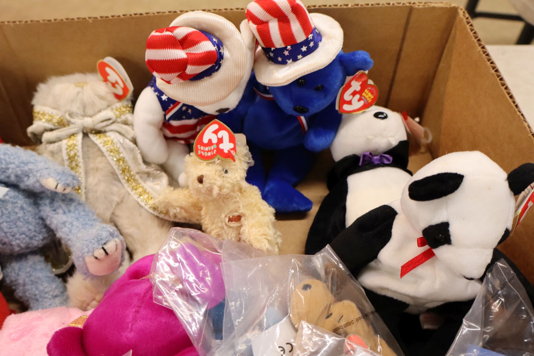 Several vintage TY babies with tags some unopened
