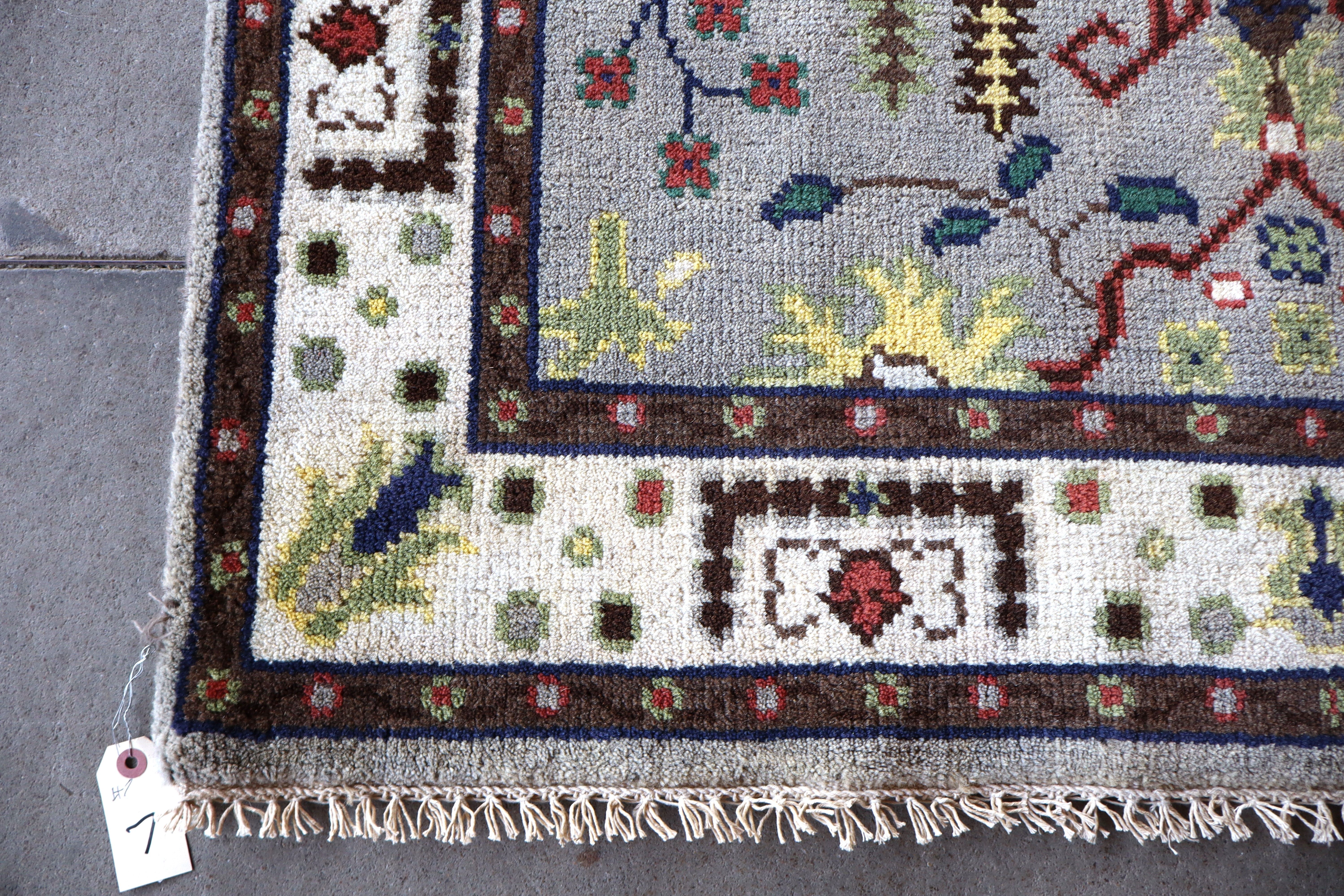 Hand stitched wool rug 72"l x 47"w