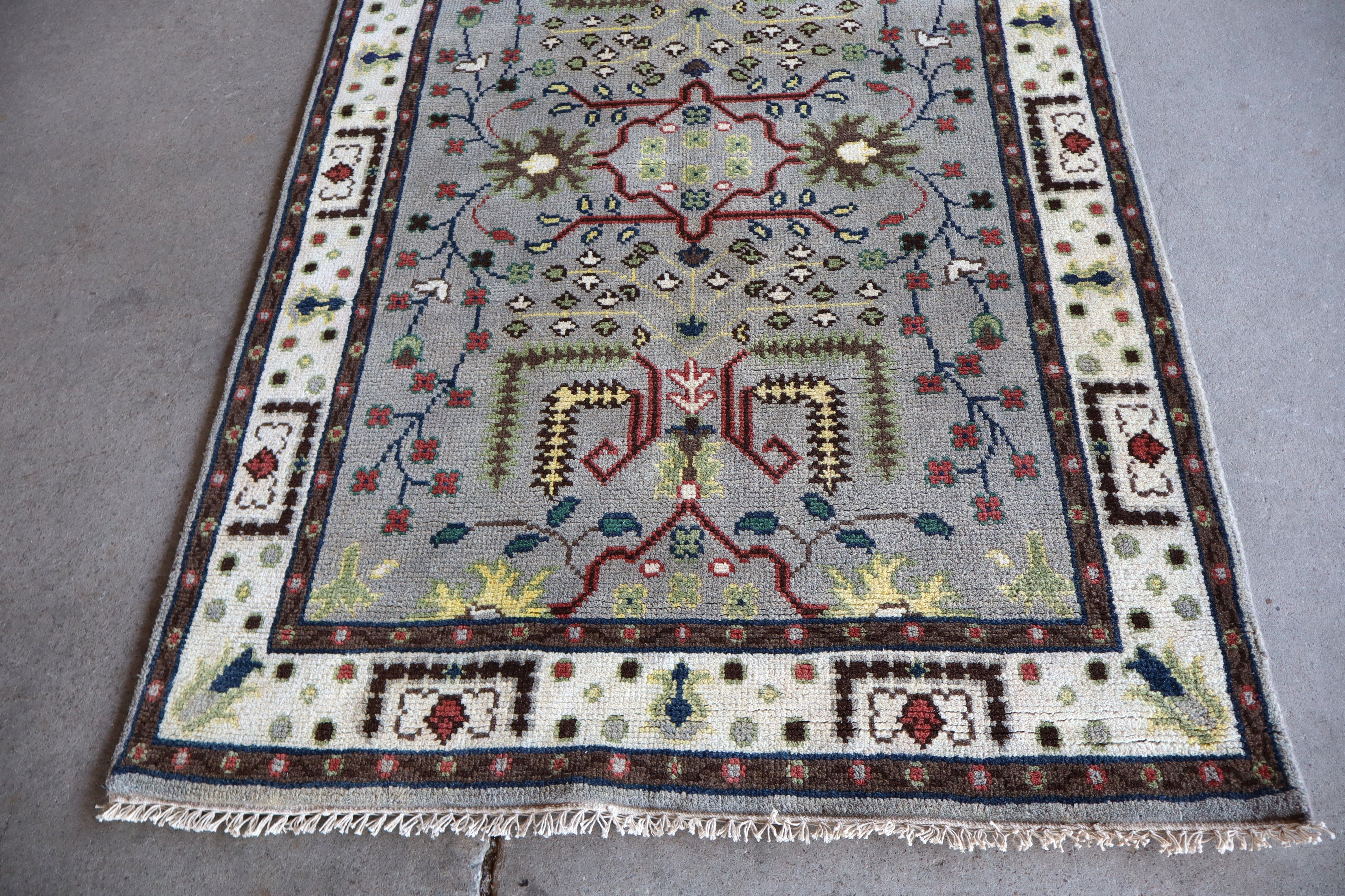 Hand stitched wool rug 72"l x 47"w