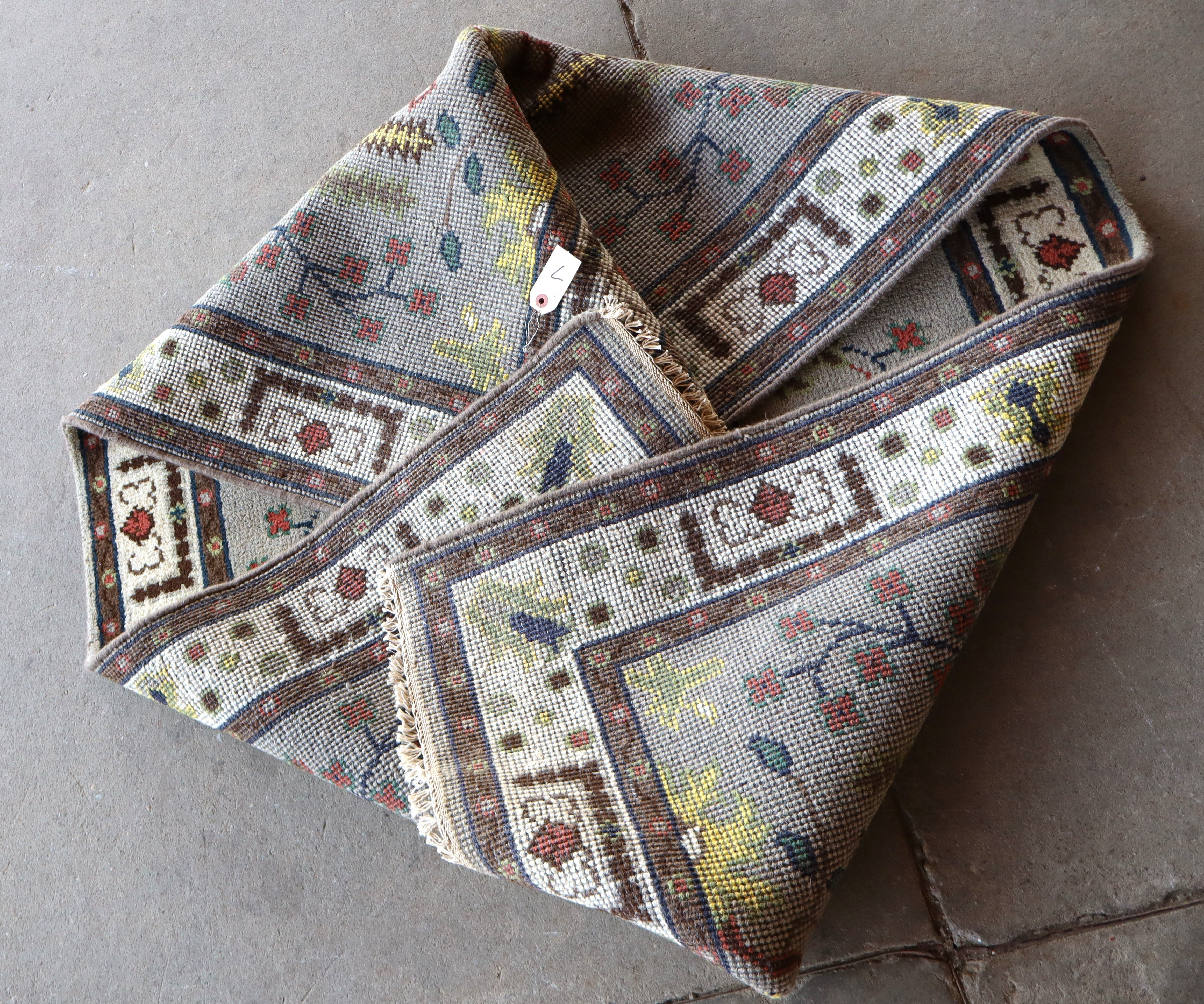 Hand stitched wool rug 72"l x 47"w