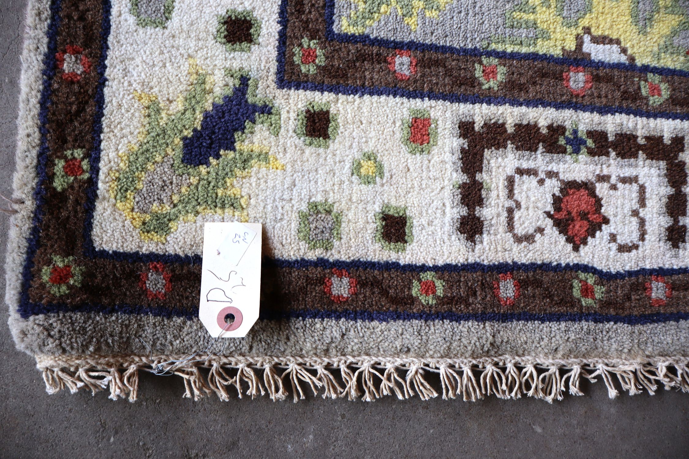 Hand stitched wool rug 72"l x 47"w