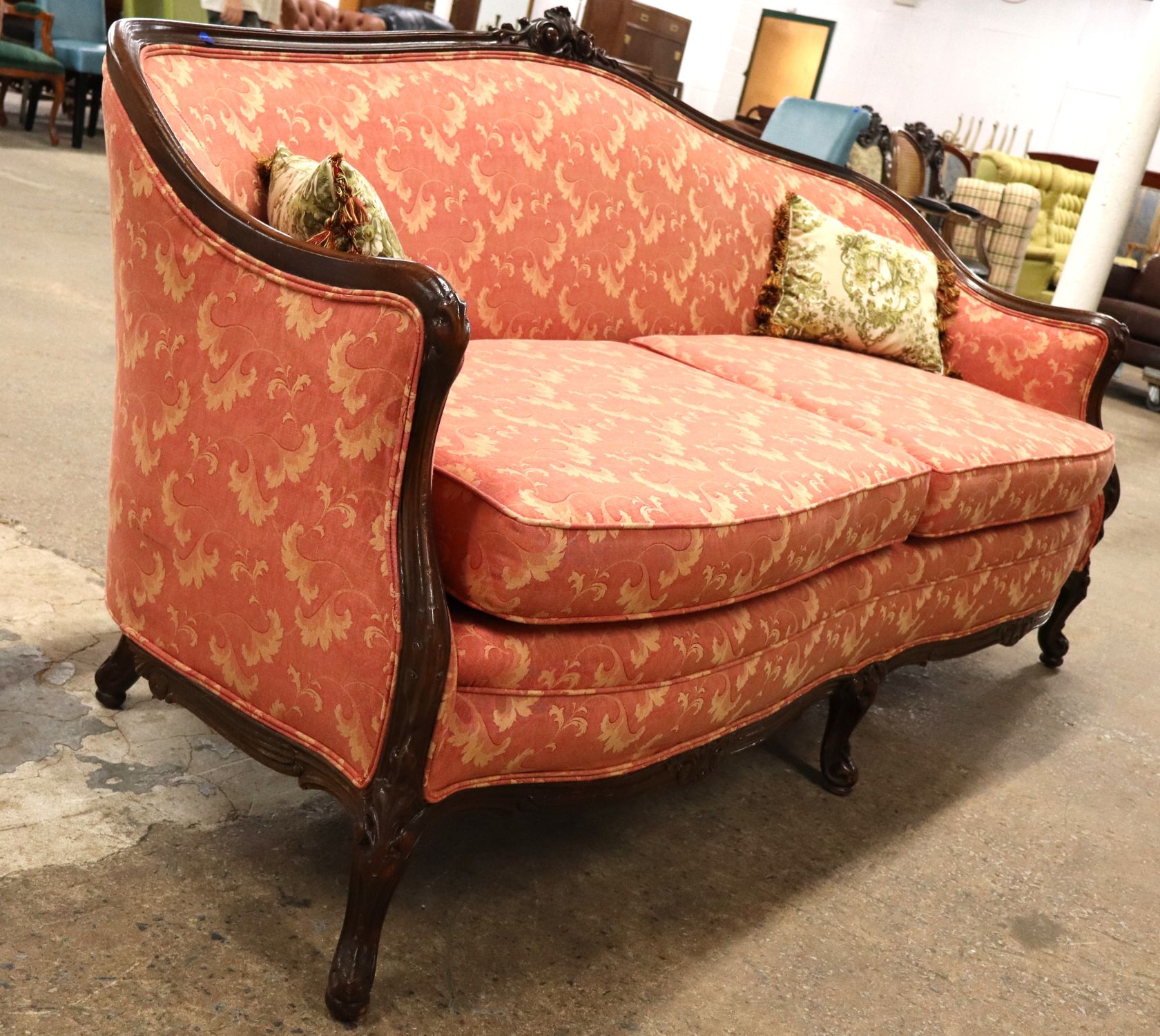 Antique 2 cushion French style mahogany framed sofa with floral upholstery