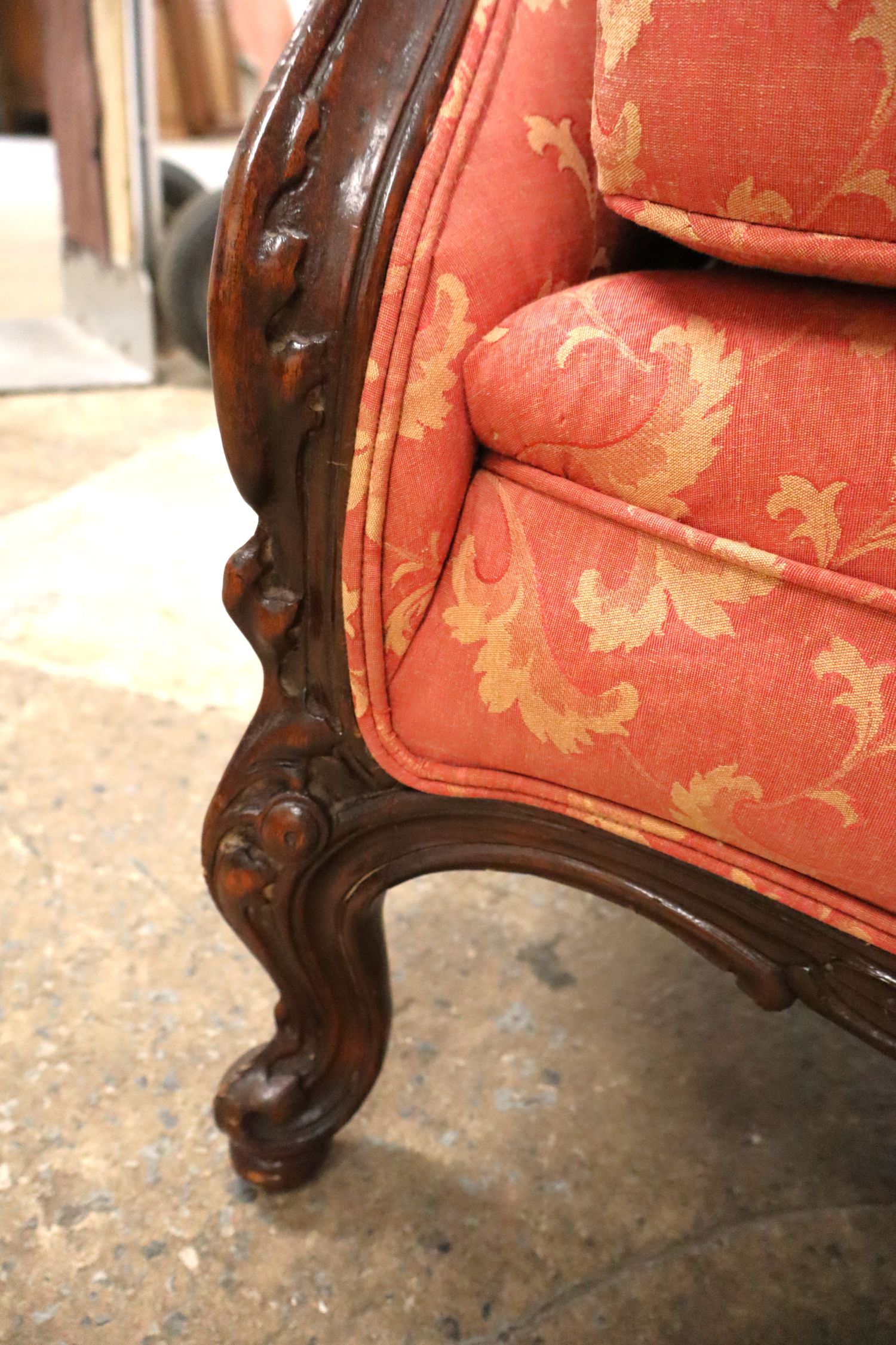 Antique 2 cushion French style mahogany framed sofa with floral upholstery