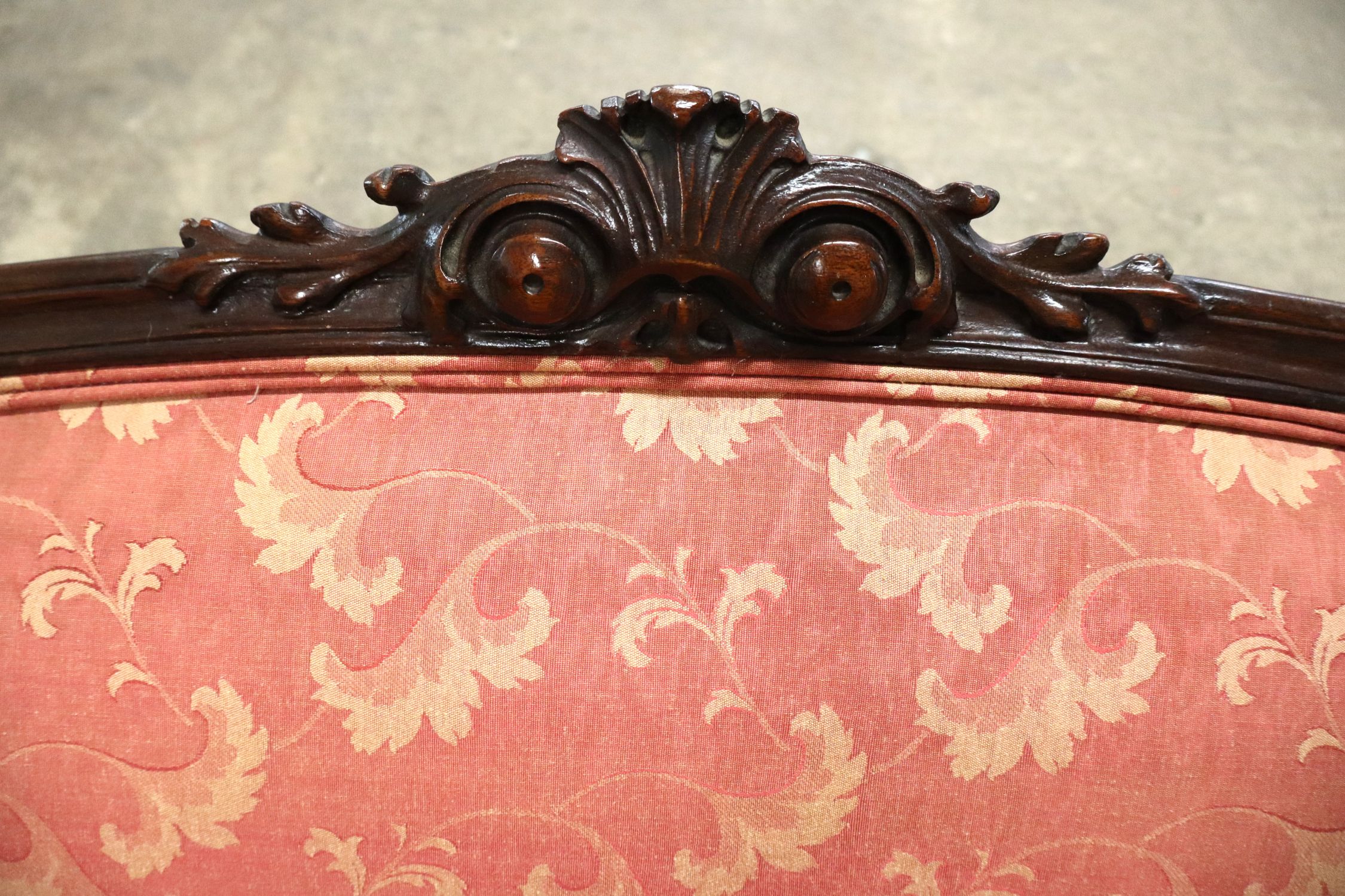 Antique 2 cushion French style mahogany framed sofa with floral upholstery