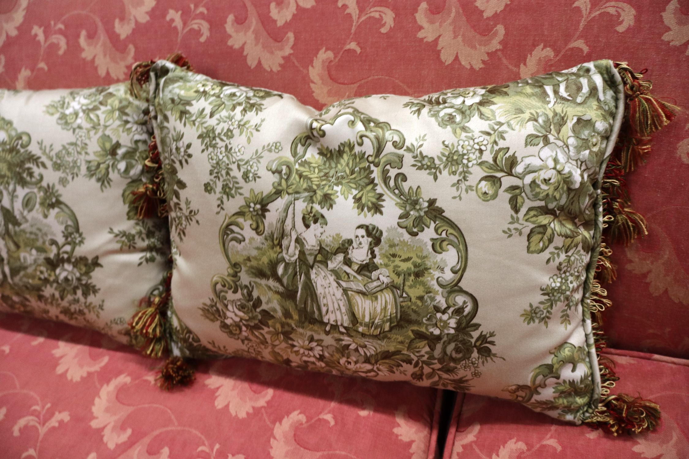 Antique 2 cushion French style mahogany framed sofa with floral upholstery