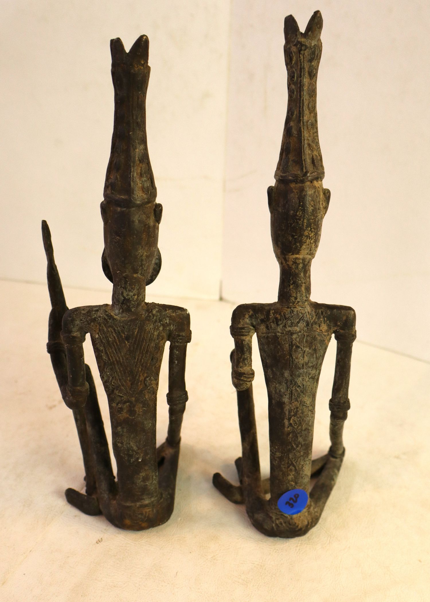 Pair bronze male and female tribal figures