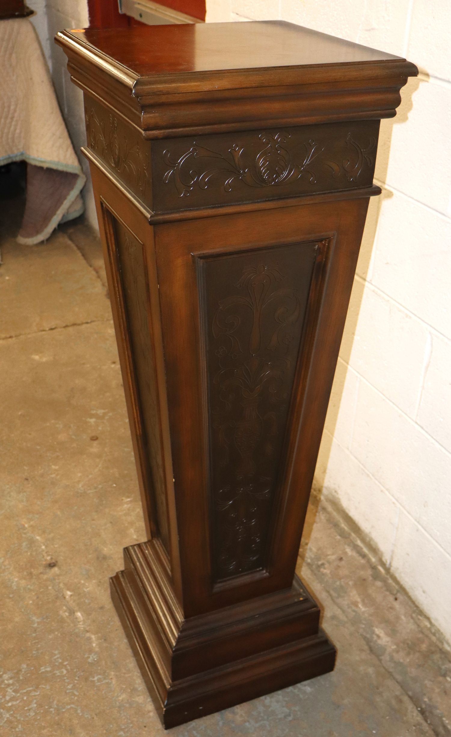 Mahogany pedestal with stamped decoration accents