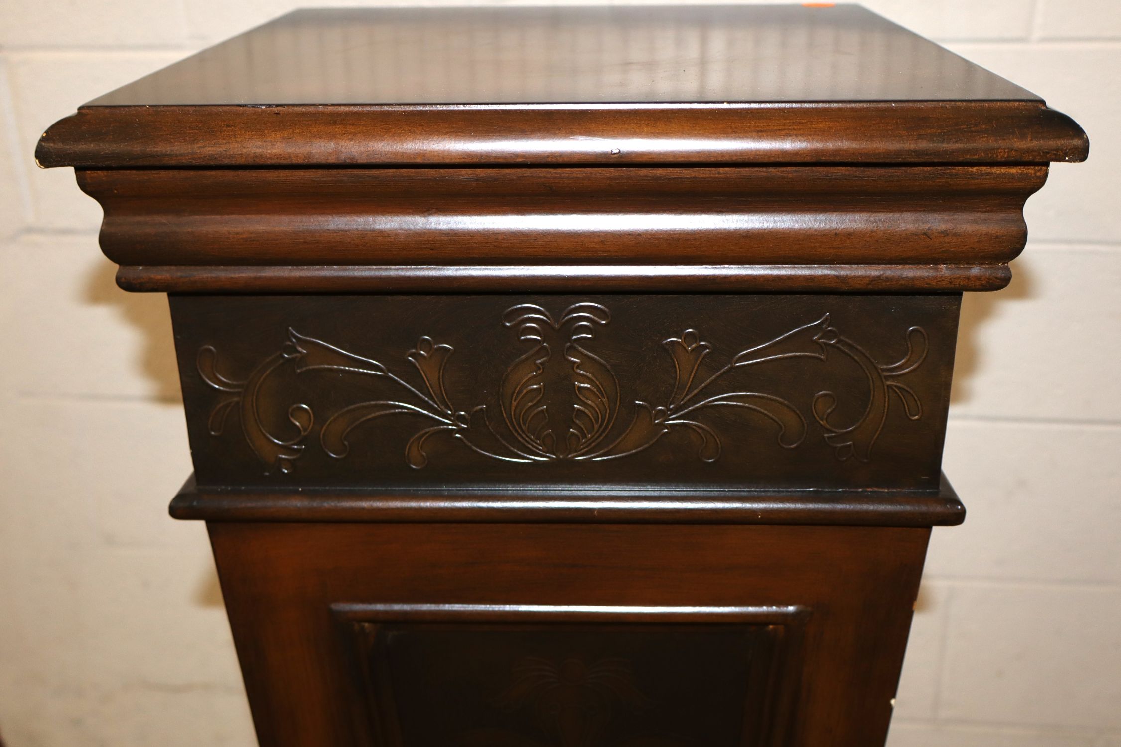 Mahogany pedestal with stamped decoration accents
