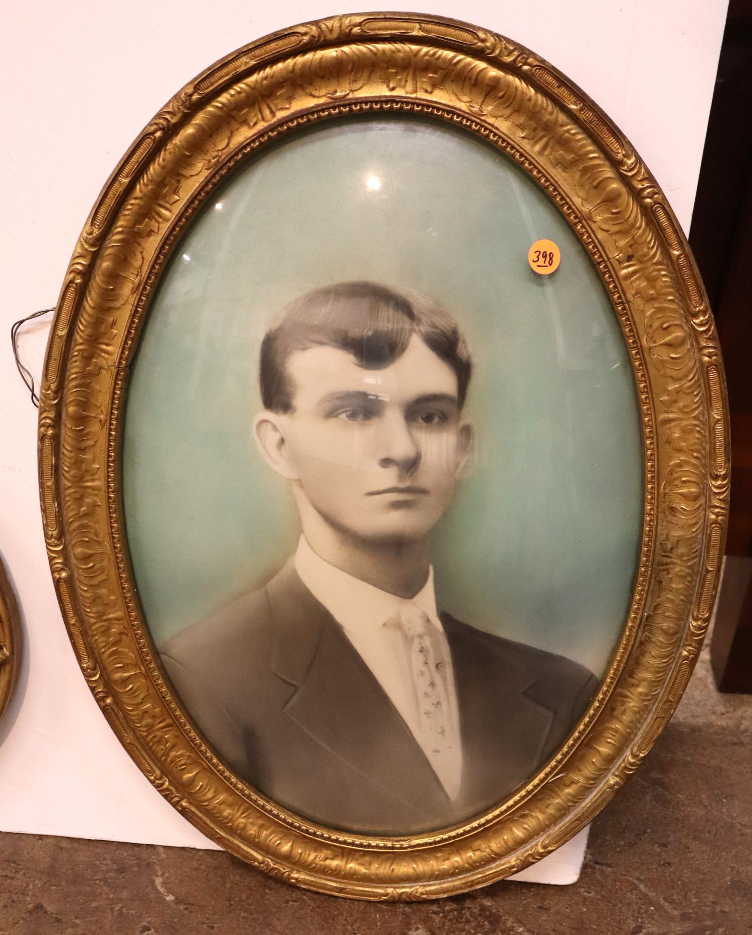 Antique oval convex glass portrait in frame