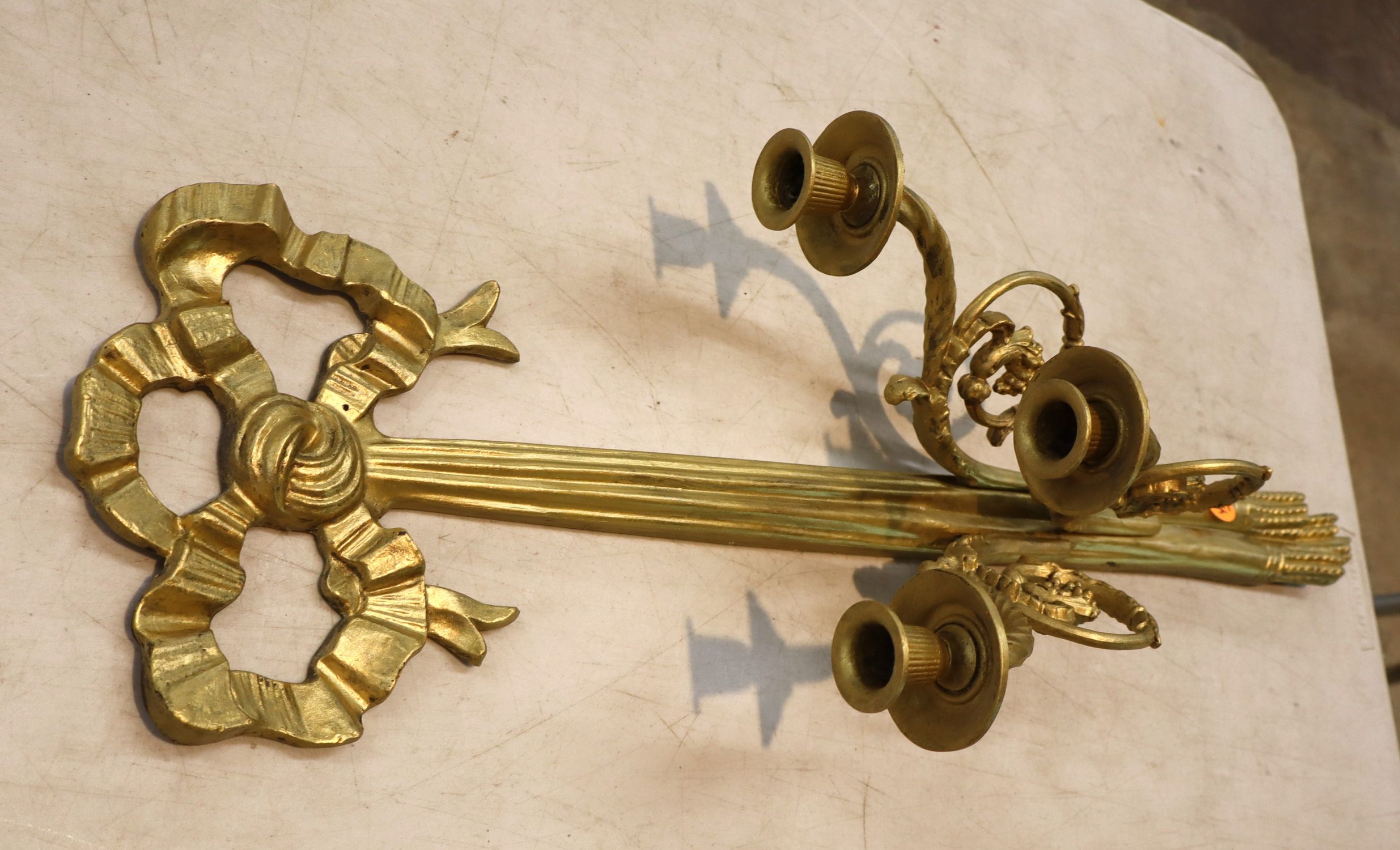 Vintage brass 3 burner wall sconce with ribbon top