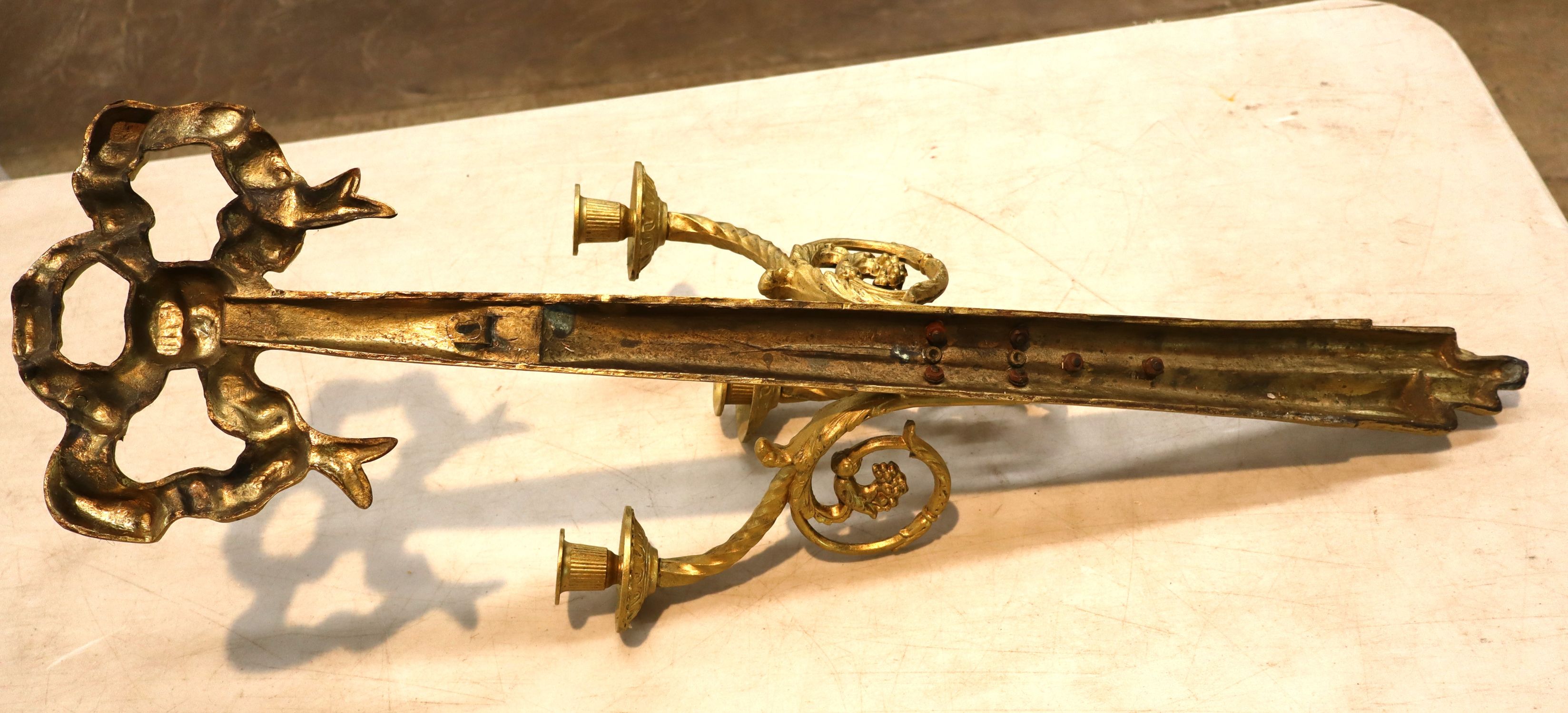 Vintage brass 3 burner wall sconce with ribbon top