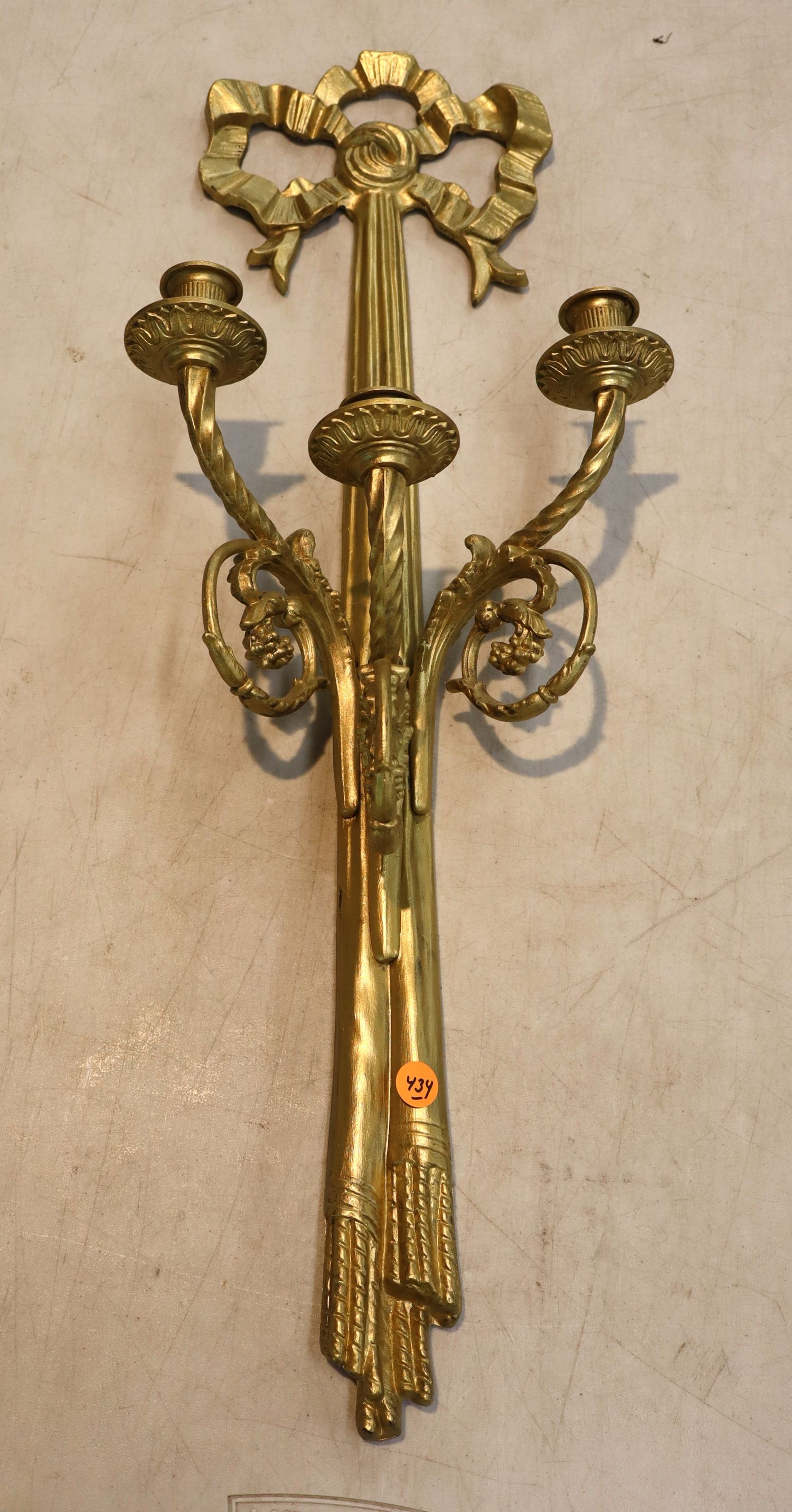 Vintage brass 3 burner wall sconce with ribbon top