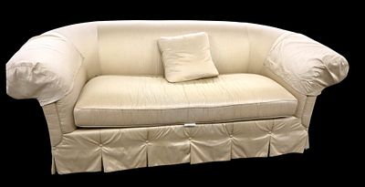Custom made designer upholstered arch back sofa with a gold satin fabric arm guards and 