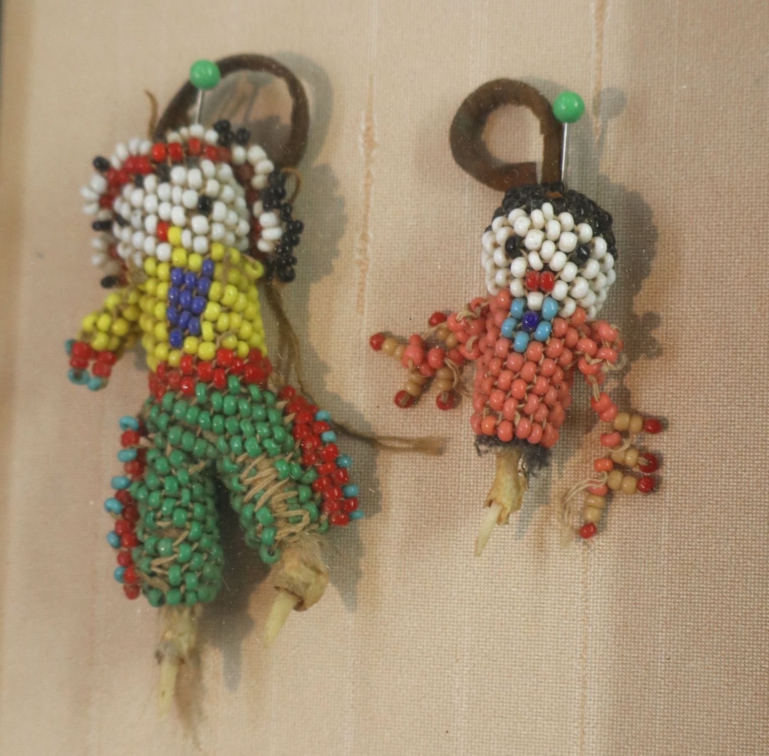 Framed 2 beaded Indian dolls and Benjamin Chee Chee artwork titled Spring Flight. 10" x 8" ea.