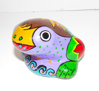 Mexican Folk Art Hand Painted Pottery Frog Figurine. The figurine measures about 4.5" by 3" 