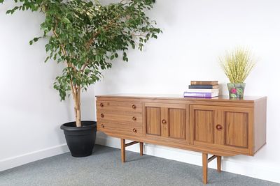 Mid-Century Modern Teak Sideboard by Emperor, circa 1960s. A single Mid-Century Modern sideboard 
