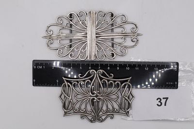 A Pair of Solid Silver Victorian Nurses Belt Buckles, Featuring Similar Scrolled Pipe Designs - 
