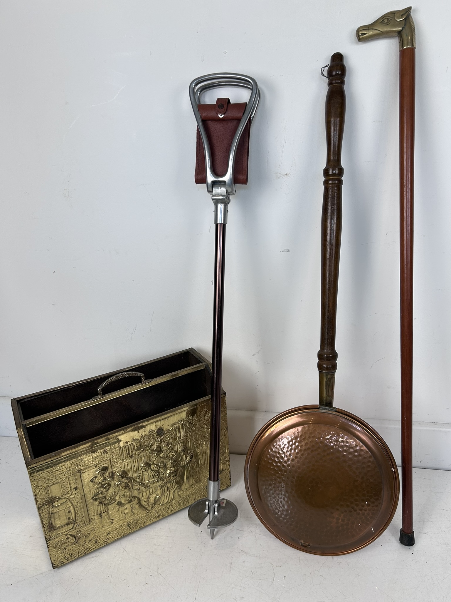 Vintage Made in Britain shooting stick, cane with a horse fashioned handle, copper bed warmer and brass magazine rack