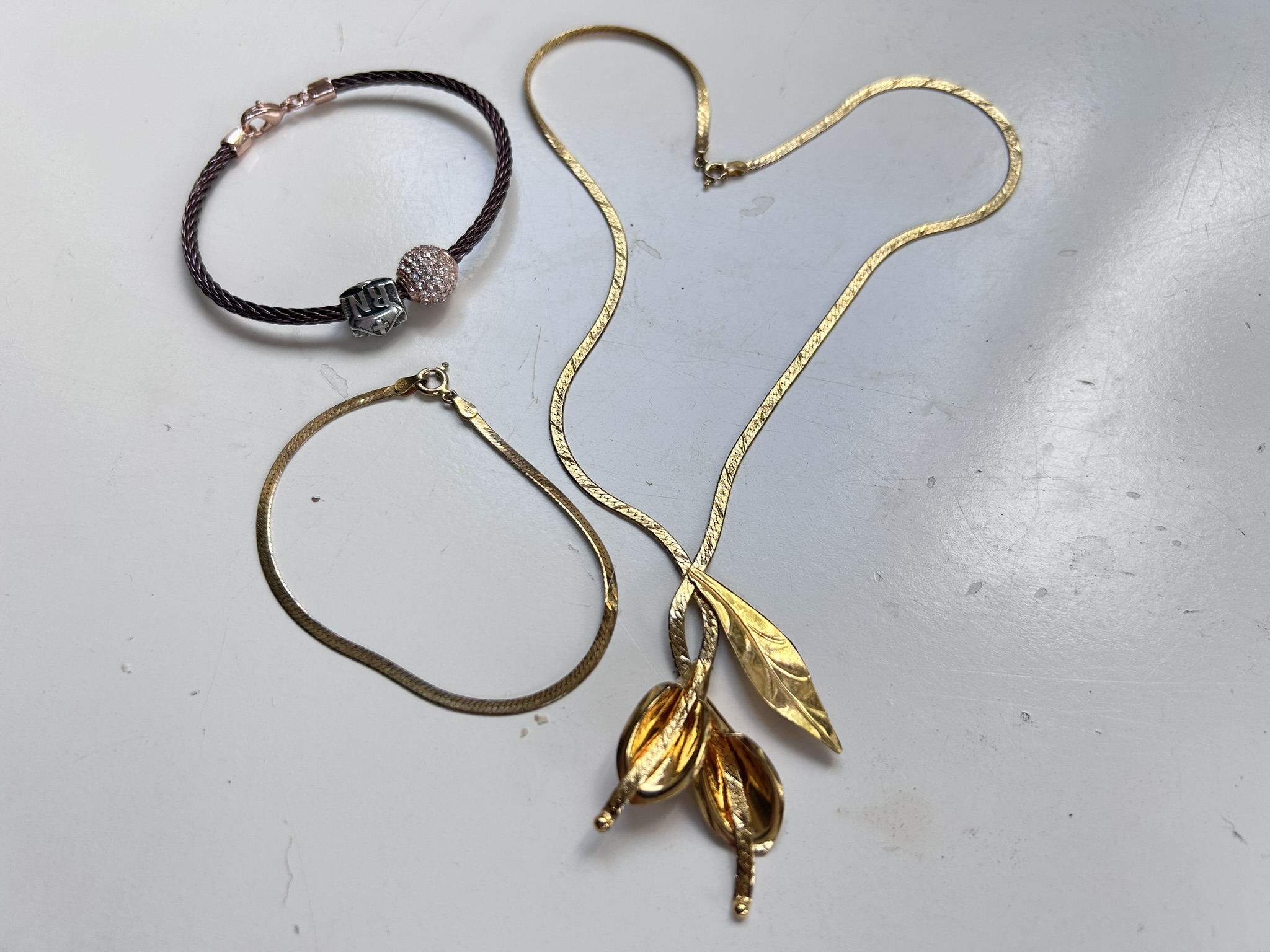 A matching Italian Harcourt Inc gold vermeil / Sterling Silver necklace and bracelet and a separate twisted steel bracelet with a Swarovski ball and Sterling Silver charm