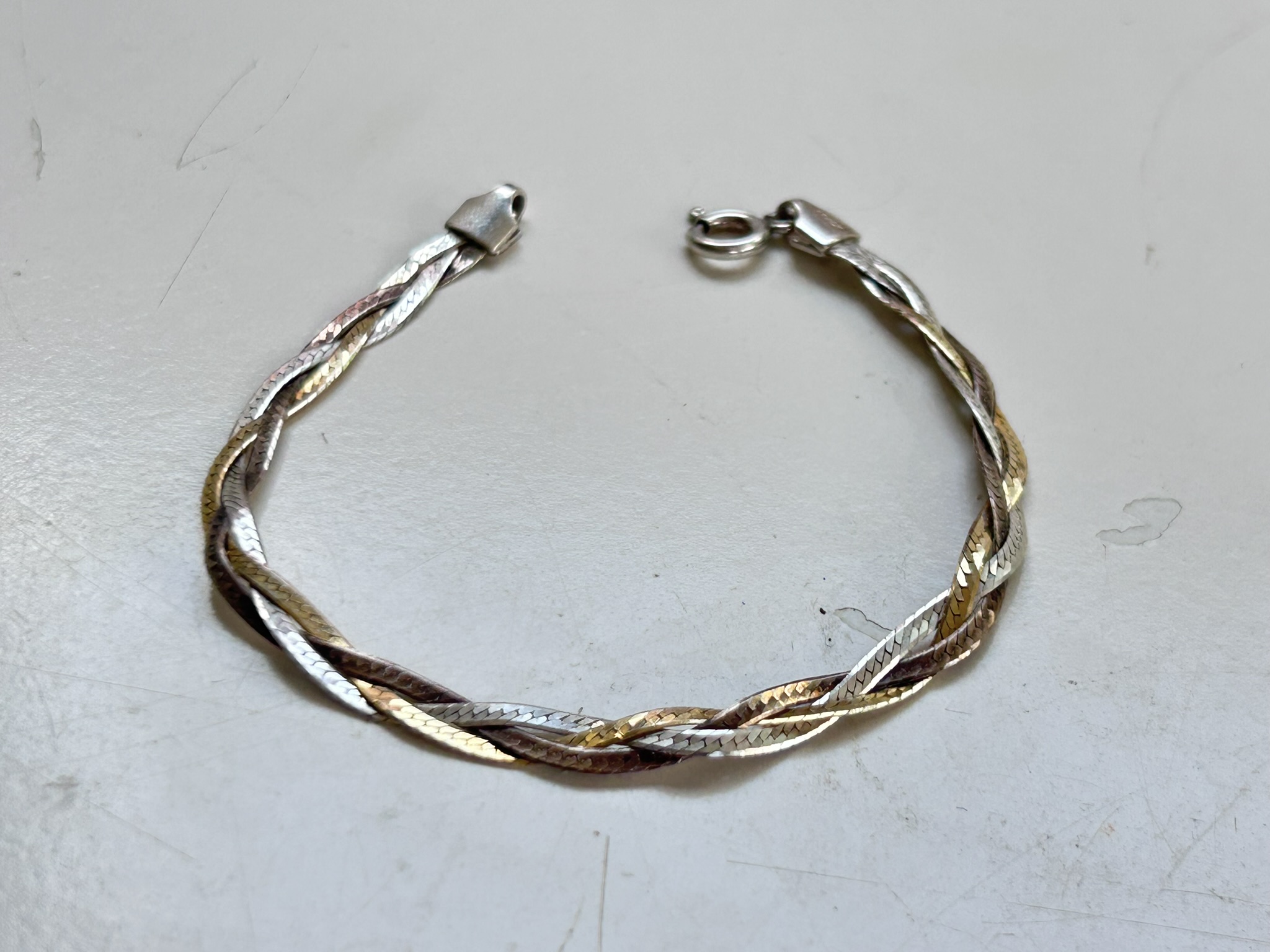 A twisted two tone Sterling Silver bracelet stamped Italy and 925 to the clasps