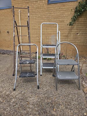 Collection of Step Ladders. Four metal step ladders of assorted forms and sizes.