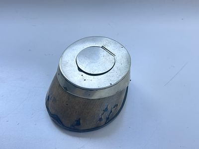 A highly unusual ink well, fashioned from a horses hoof, with a lift up lid, glass receptacle 