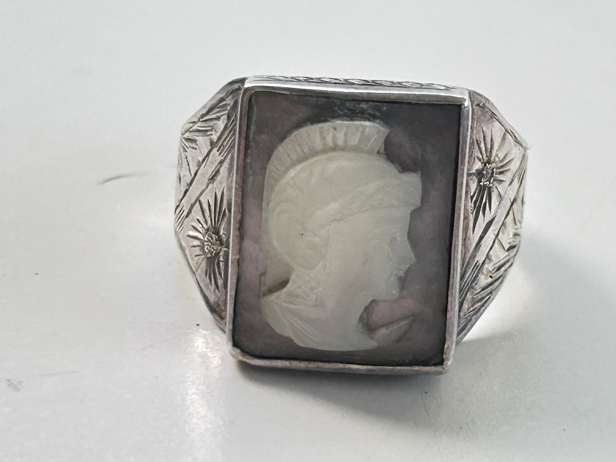 A nice Art Deco period hand carved Cameo set ring, likely carved in Italy but possibly set in the US, feint stamp looks like 900
