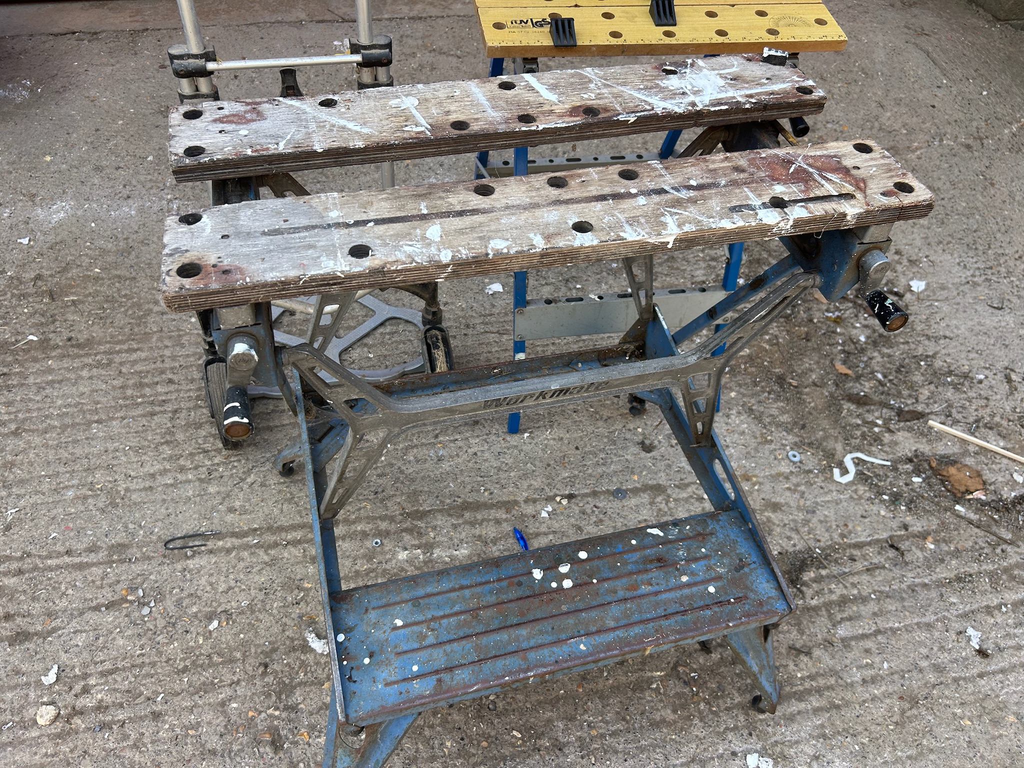 A Black and Decker Workmate, and one similar and a folding sack barrow
