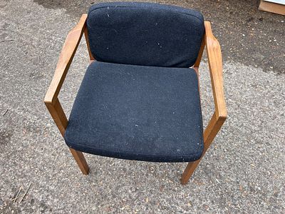 Mid-century Danish occasional chair with a teak frame and black wool upholstery