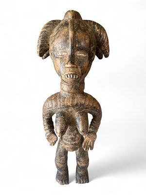 Carved Female Tribal Figure, Baule People, Ivory Coast, mid-20th century. Carved hardwood 