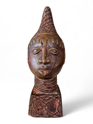 Benin-Style Bronze Head, Nigeria, 20th Century. A finely cast bronze head inspired by the royal 